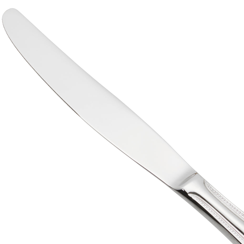 World Tableware 407 5501 Calais 10" 18/8 Stainless Steel Extra Heavy Weight Solid Handle Dinner Knife with Serrated Blade - 12/Pack