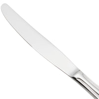 World Tableware 407 5501 Calais 10" 18/8 Stainless Steel Extra Heavy Weight Solid Handle Dinner Knife with Serrated Blade - 12/Pack