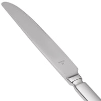 World Tableware 213 5511 Baguette 8 3/4" 18/0 Stainless Steel Heavy Weight Serrated Solid Handle Dessert Knife with Pinched Bolster - 12/Pack