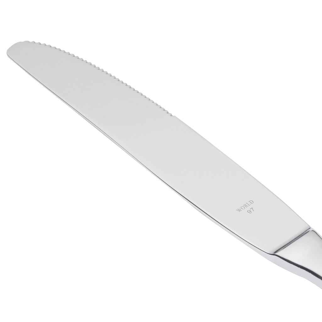 World Tableware 213 5503 Baguette 9 3/4" 18/0 Stainless Steel Heavy Weight Serrated Solid Handle Dinner Knife - 12/Pack