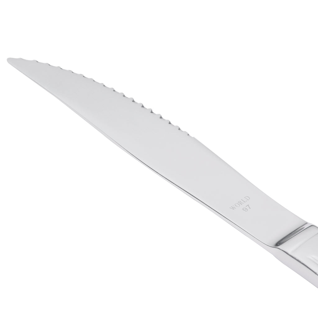 World Tableware 256 5762 Cortland 8 7/8" 18/0 Stainless Steel Heavy Weight Fluted Solid Handle Steak Knife - 12/Pack