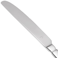 World Tableware 213 5501 Baguette 9 3/4" 18/0 Stainless Steel Heavy Weight Serrated Solid Handle Dinner Knife - 12/Pack
