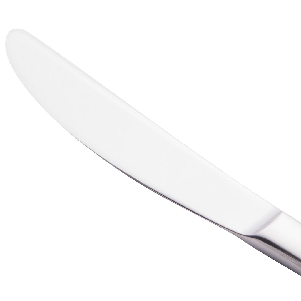 World Tableware 962 5501 Oceanside 9 1/4" 18/0 Stainless Steel Heavy Weight Solid Handle Dinner Knife with Serrated Blade - 12/Pack