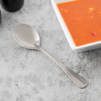 World Tableware 998 004 Farmhouse 7 1/4" 18/0 Stainless Steel Heavy Weight Bouillon Spoon - 12/Pack